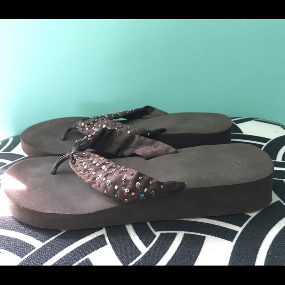 Brown wedged flip-flops
